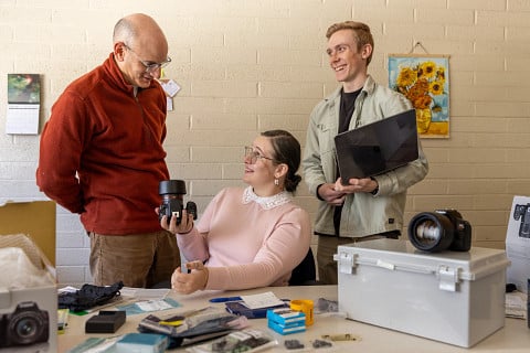Professor David Trilling, grad-student Maria Chernyavskaya, and undergrad Gavin Moriarty looking over parts of a PANOPTES telscope.