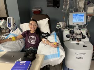 Andrea Trujillo Lerner hooked up to an apheresis machine to donate stem cells.